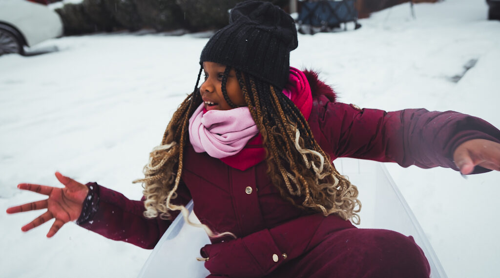 child on sled